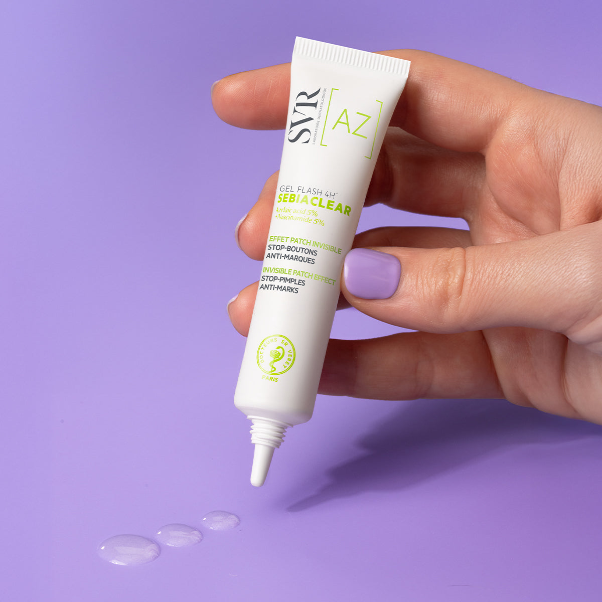 Hand holding a white SVR Sebiaclear Gel Flash 4H tube with green text, dispensing clear gel onto a purple background.