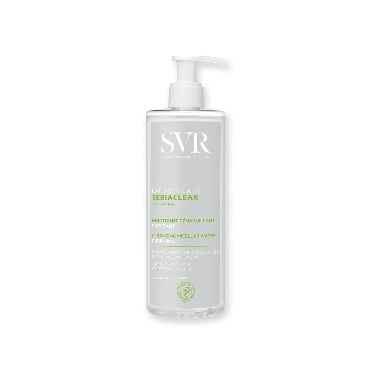 Envase cilíndrico de 400ml de agua micelar SVR Sebiaclear con dosificador, etiqueta blanca y detalles en verde sobre fondo gris.