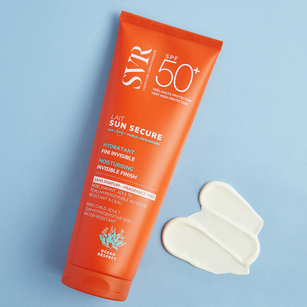 Orange SVR SUN SECURE SPF50+ sunscreen tube with a dollop of white cream on a light blue background.