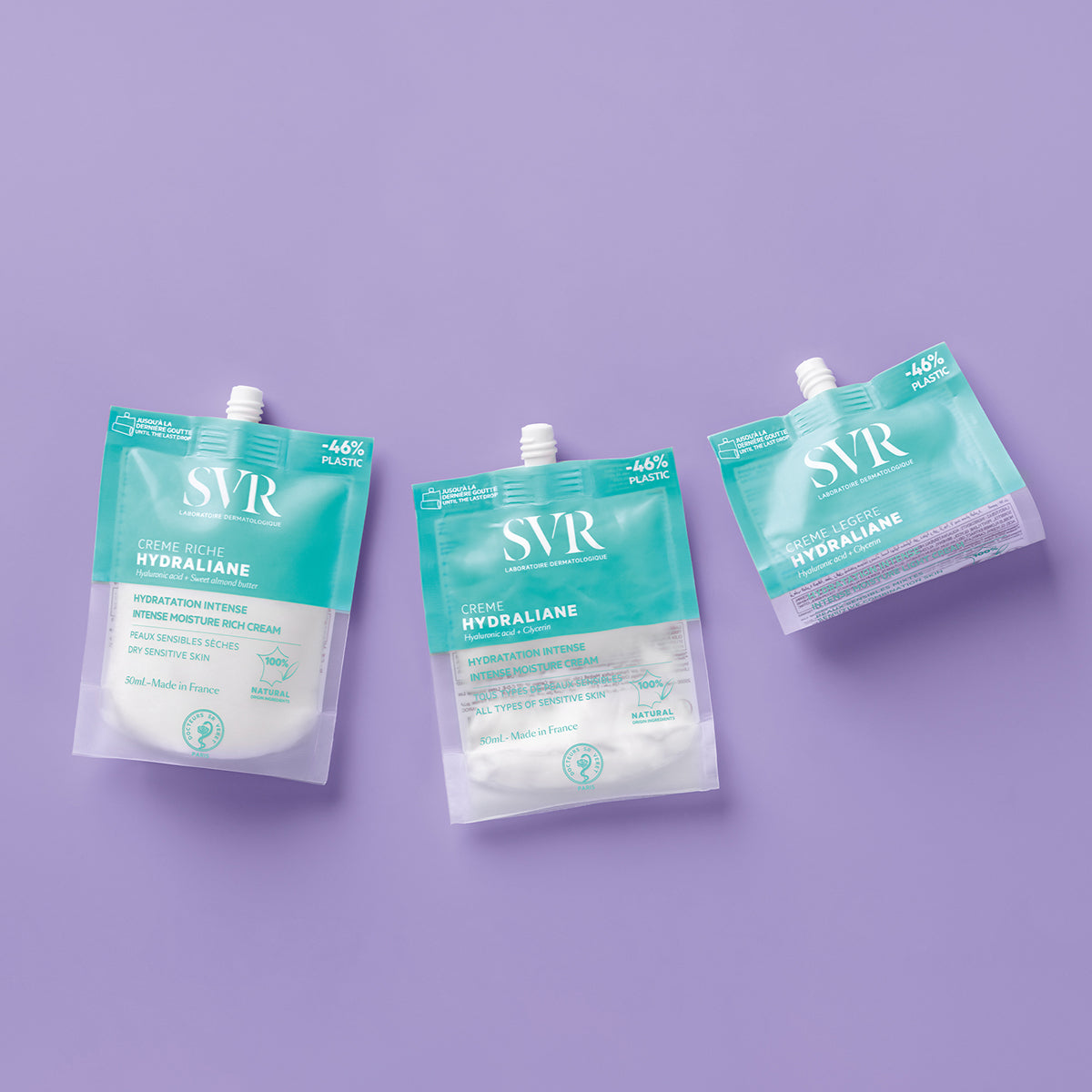 Tres envases flexibles y reciclables de crema hidratante SVR Hydraliane sobre fondo lila, con diseño minimalista en azul turquesa.