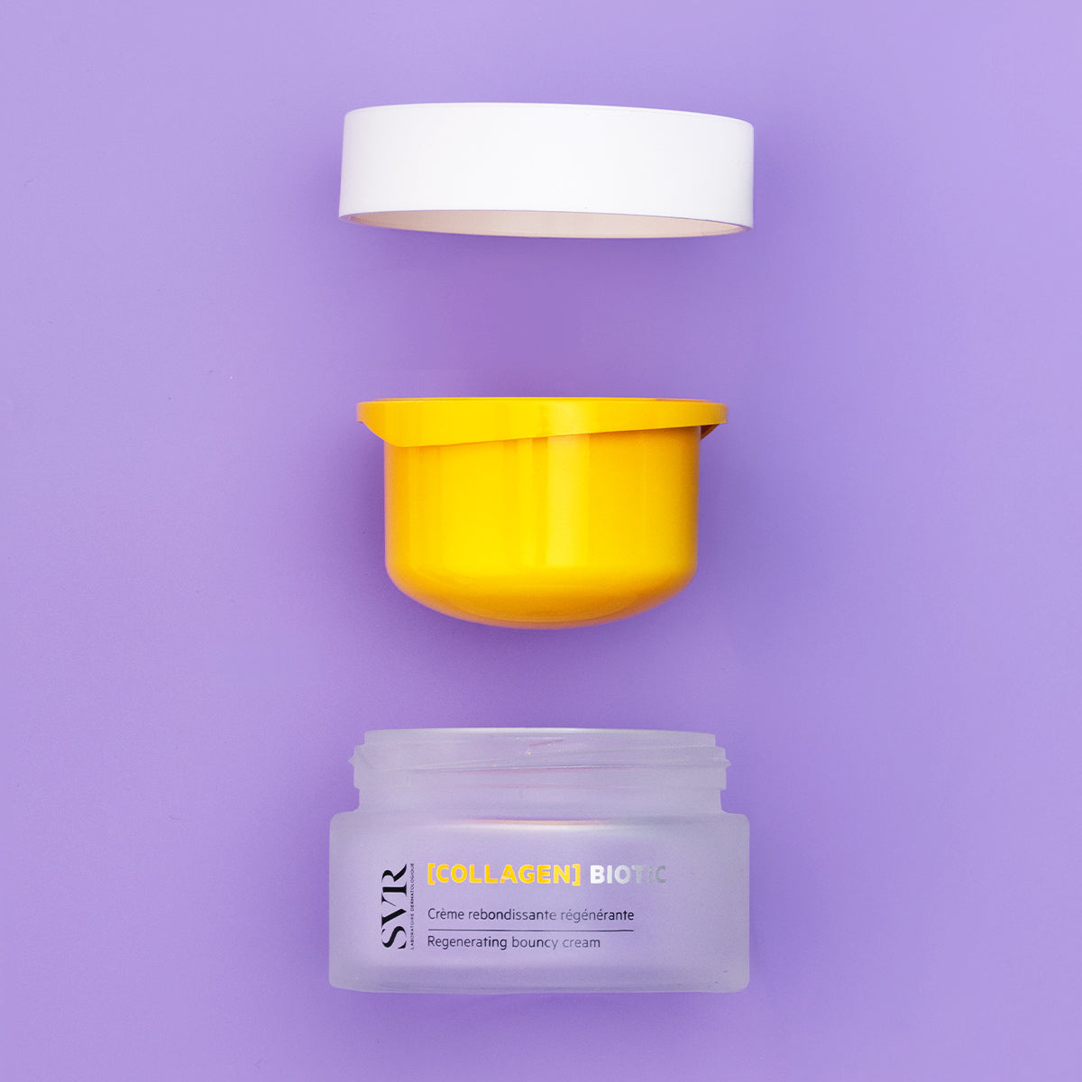 Crema SVR [COLLAGEN] Biotic en tarro de vidrio esmerilado con tapa blanca y envase interior amarillo sobre fondo lila.