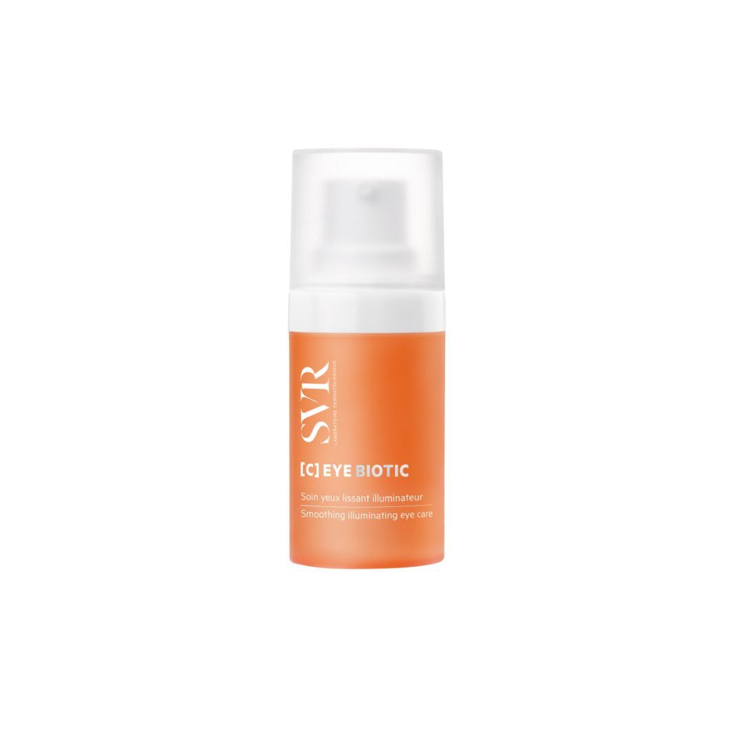 Envase cilíndrico naranja de SVR [C] EYE BIOTIC con tapa translúcida y dosificador para contorno de ojos.